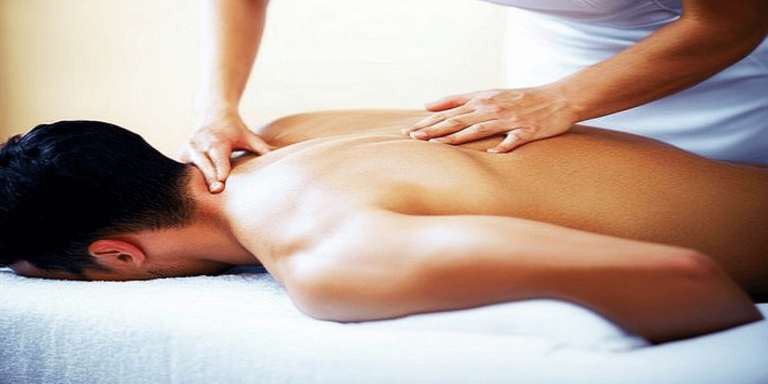 u1221652487 A man lying face down on a massage table with a f 81c4159f 20ca 42fa 9535 7d1f729575b1 1 768x384